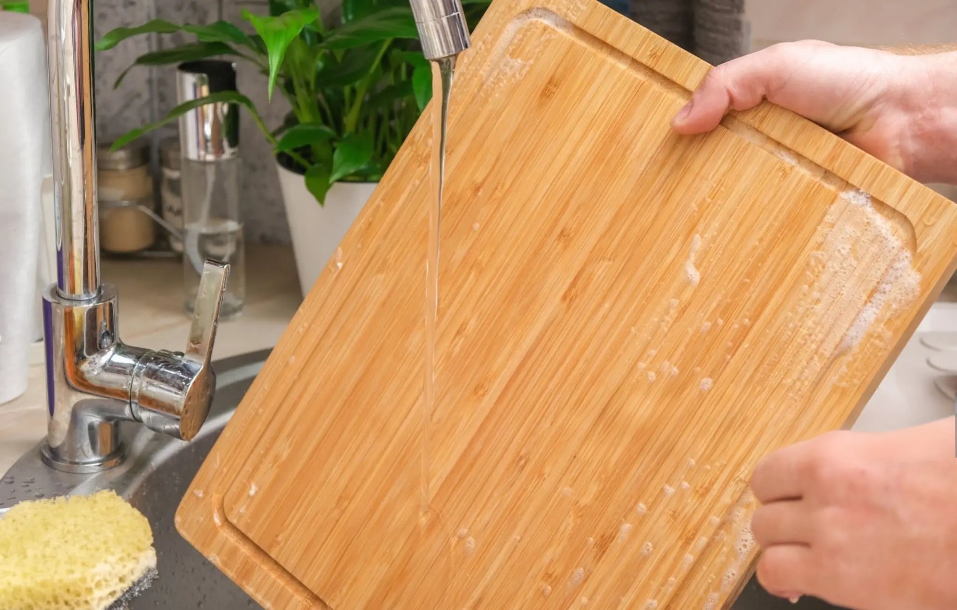 rinsing a wooden cutting board