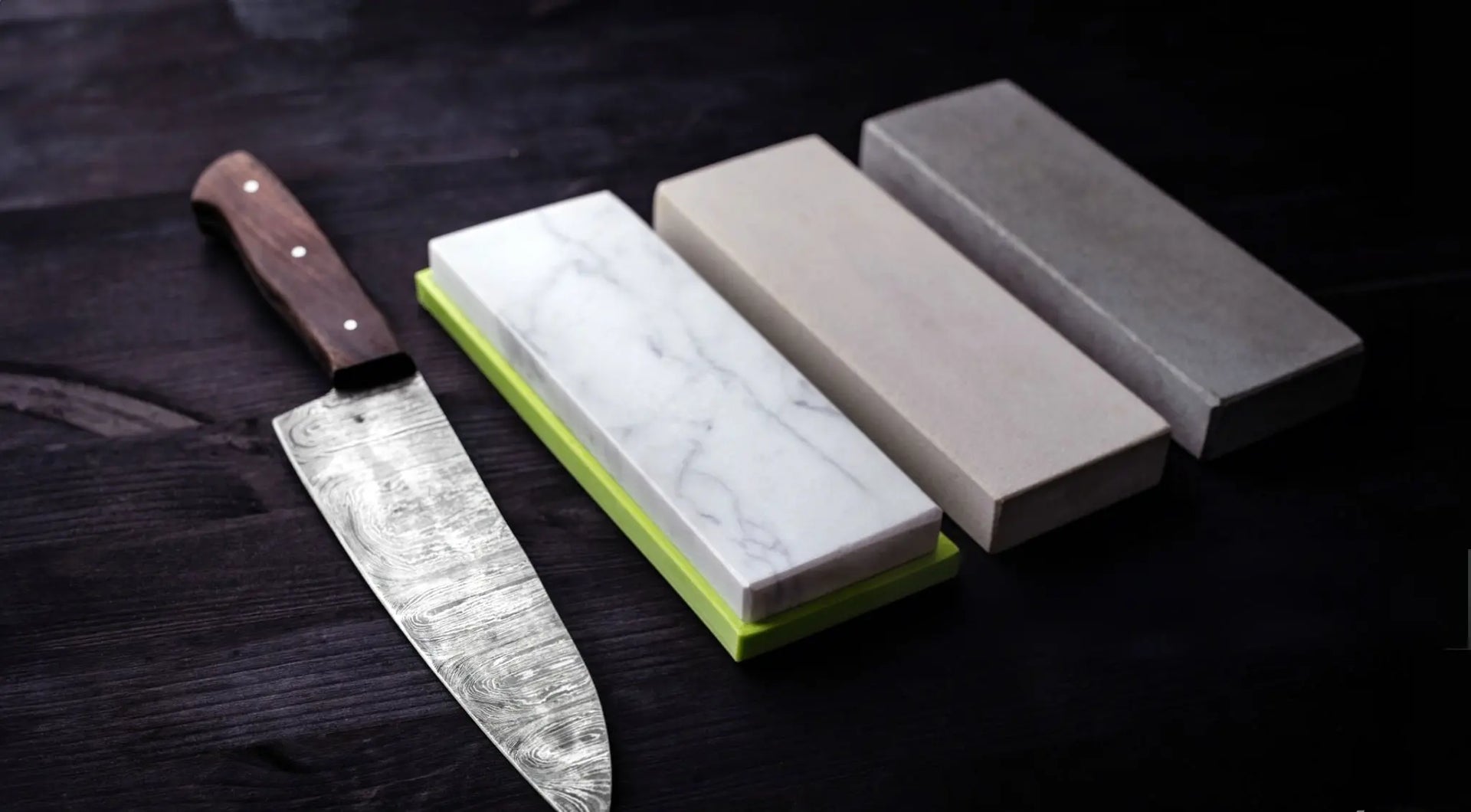 three whetstones and a sharp Japanese knife